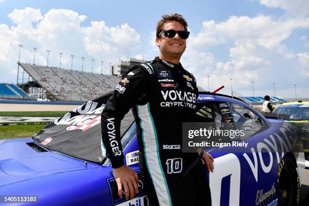 Landon Cassill, driver of the Voyager: Crypto for All Chevrolet, waits on the grid prior to the NASCAR Xfinity Series Tennessee Lottery 250at...