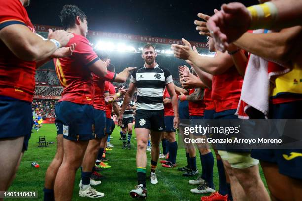 Spain players from a guard of honor to Tom Wood of the Barbarians after the Spain v Barbarians match at El Molinon stadium on June 25, 2022 in Gijon,...