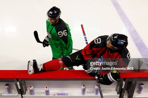 Aaron Palushaj of Team Carbonneau stretches in front of Tim Davison of Team Murphy during 3ICE Week Two at Magness Arena on June 25, 2022 in Denver,...