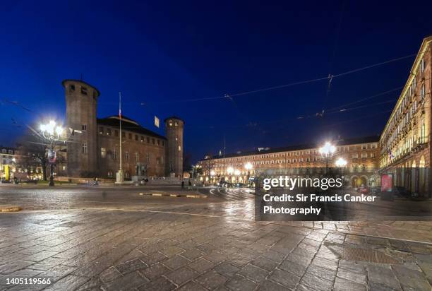 piazza castello illuminated at night with prominent "casaforte degli acaja" in turin, piedmont, italy - regency romance stock pictures, royalty-free photos & images