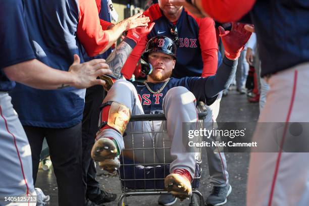 Alex Verdugo of the Boston Red Sox celebrates with teammates after hitting a three-run home run off Shane Bieber of the Cleveland Guardians during...