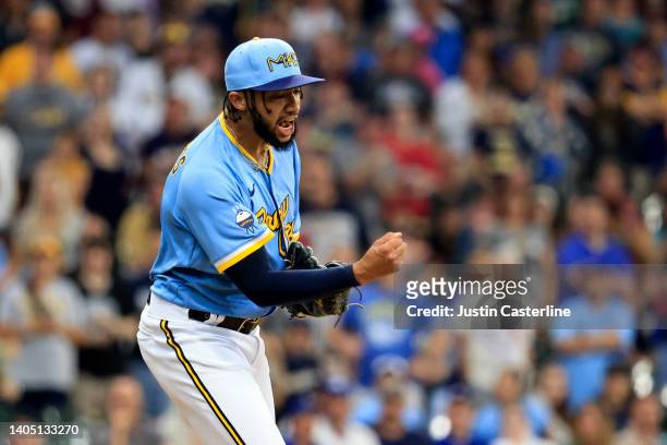 Devin Williams of the Milwaukee Brewers reacts after a strikeout during the eighth inning in the game against the Toronto Blue Jays at American...