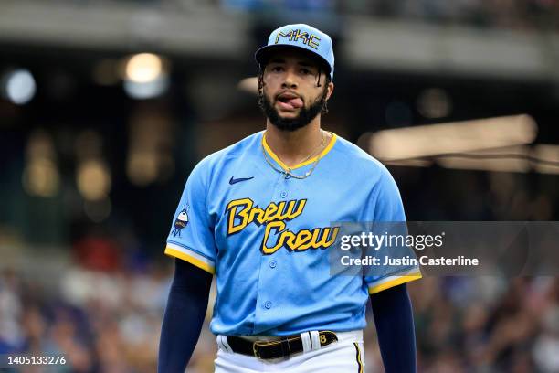 Devin Williams of the Milwaukee Brewers walks back to the dugout after the eighth inning in the game against the Toronto Blue Jays at American Family...