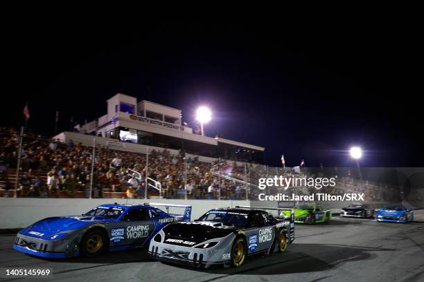 Ryan Hunter-Reay and Ernie Francis Jr. #5 race during the Camping World Superstar Racing Experience event at South Boston Speedway on June 25, 2022...