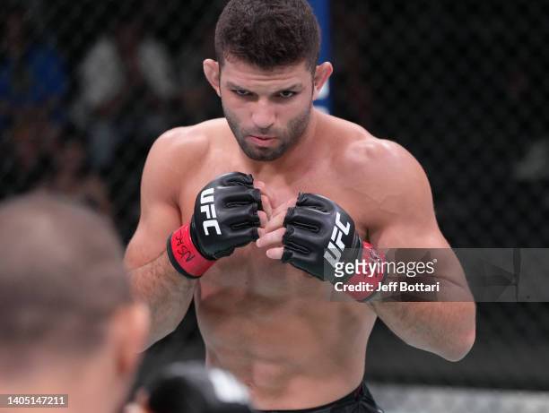 Thiago Moises of Brazil battles Christos Giagos in a lightweight fight during the UFC Fight Night event at UFC APEX on June 25, 2022 in Las Vegas,...