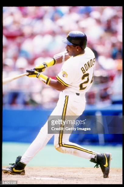 Left fielder Barry Bonds of the Pittsburgh Pirates swings at the ball during a game against the San Diego Padres at Three Rivers Stadium in...