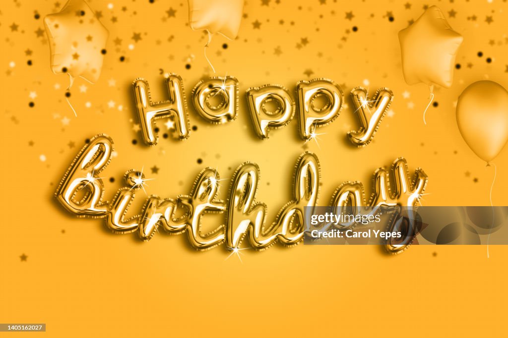 Happy birthday in orange and yellow foiled balloon