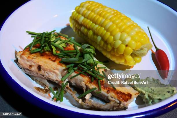 barramundi asian sea bass fish fillet served in a plate - giant perch stock pictures, royalty-free photos & images