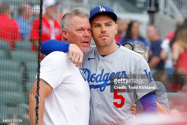Freddie Freeman of the Los Angeles Dodgers hugs hitting consultant, Chipper Jones of the Atlanta Braves prior to the game at Truist Park on June 25,...