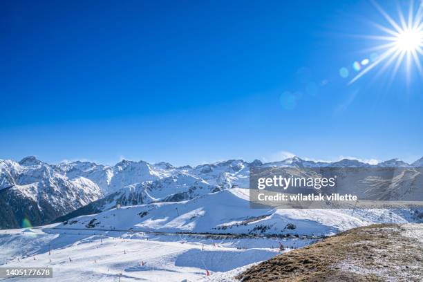 mountains covered with snow on a sunny day. - autoreifen natur stock-fotos und bilder