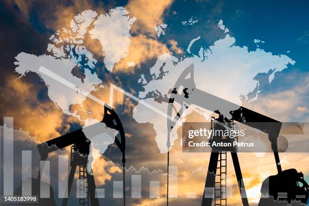 oil pump on the background of the world map. world energy crisis - oil prices stock-fotos und bilder