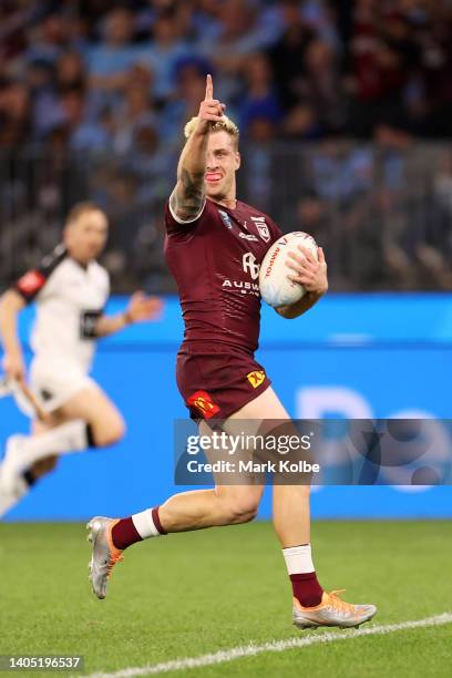 Cameron Munster of the Maroons celebrates scoring a try during game two of the State of Origin series between New South Wales Blues and Queensland...