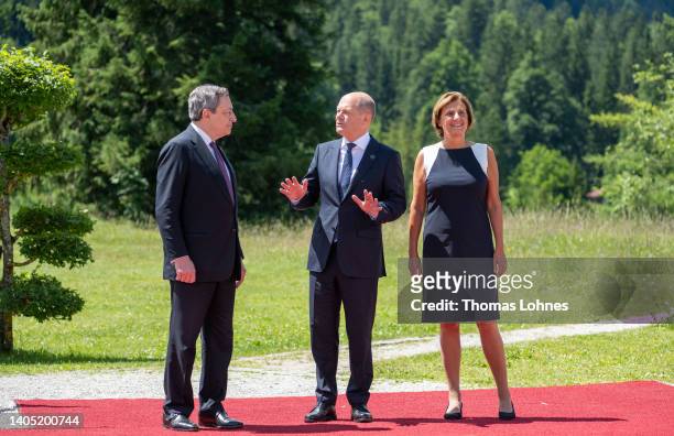 German Chancellor Olaf Scholz , his wife Britta Ernst and Italian Prime Minister Mario Draghi chat during a welcoming ceremony at Schloss Elmau on...