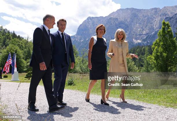 German Chancellor Olaf Scholz, French President Emmanuel Macron, Scholz's wife Britta Ernst and Macron's wife Brigitte Macron chat on the first day...