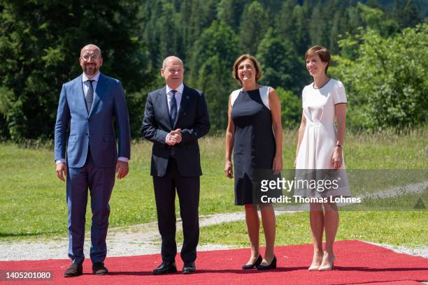 German Chancellor Olaf Scholz , his wife Britta Ernst , European Council President Charles Michel and his partner Amelie Derbaudrenghien chat during...