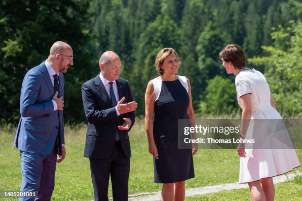German Chancellor Olaf Scholz , his wife Britta Ernst , European Council President Charles Michel and his partner Amelie Derbaudrenghien chat during...