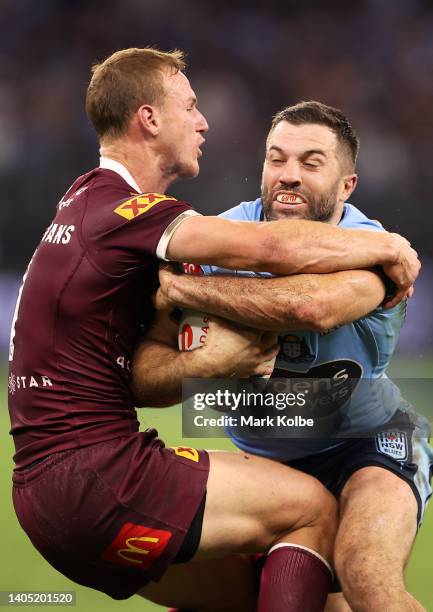 James Tedesco of the Blues is tackled by Daly Cherry-Evans of the Maroons during game two of the State of Origin series between New South Wales Blues...