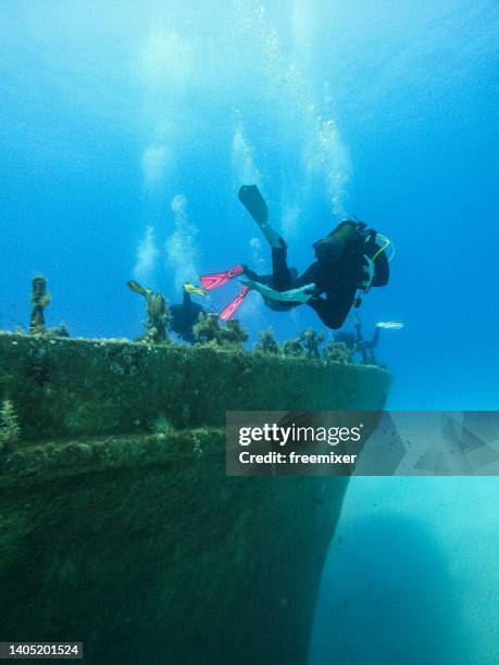 diving over a shipwreck - malta diving stock pictures, royalty-free photos & images