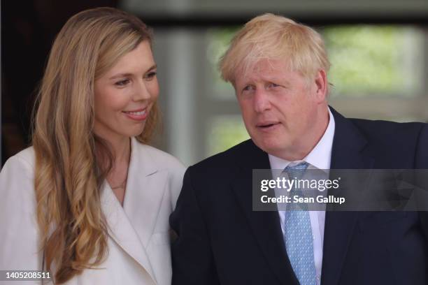 British Prime Minister Boris Johnson and wife Carrie Johnson walk to the first working session on the first day of the three-day G7 summit at Schloss...