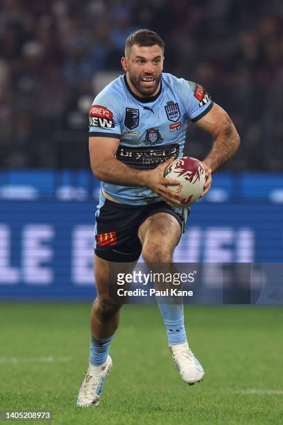 James Tedesco of the Blues runs the ball during game two of the State of Origin series between New South Wales Blues and Queensland Maroons at Optus...