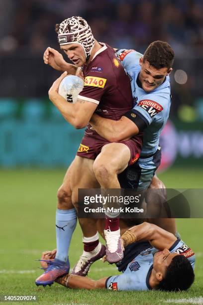 Kalyn Ponga of the Maroons is tackled during game two of the State of Origin series between New South Wales Blues and Queensland Maroons at Optus...
