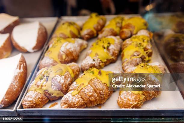 close-up of cornetti (italian croissants) with pistachio creme, rome, italy - serving dish foto e immagini stock