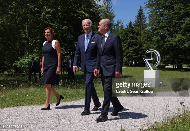 German Chancellor Olaf Scholz and his wife Britta Ernst walk with U.S. President Joe Biden on the first day at the G7 summit at Schloss Elmau on June...