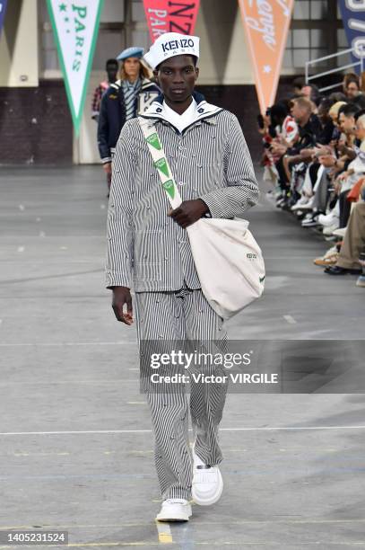 Model walks the runway during the Kenzo Ready to Wear Spring/Summer 2023 fashion show as part of the Paris Men Fashion Week on June 26, 2022 in...