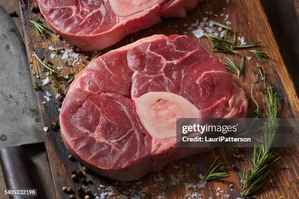 seasoning raw beef shanks - chuck stock pictures, royalty-free photos & images