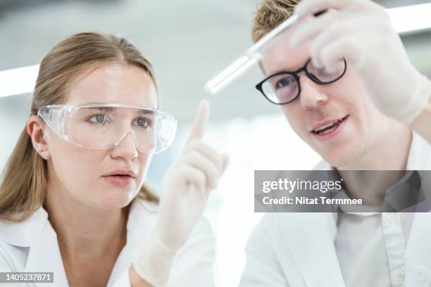 promoting gender equality in science and technology. chemist or scientists is having decision on test tube and examining of scientific sample in a laboratory. - medical technologist stock pictures, royalty-free photos & images