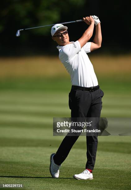 Haotong Li of China plays their second shot on the 14th hole during Day Four of the BMW International Open at Golfclub Munchen Eichenried on June 26,...