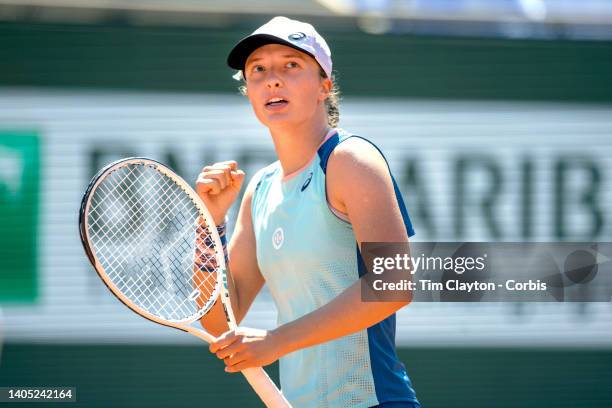 Iga Swiatek of Poland reacts during her match against Jessica Pegula of the United States on Court Philippe Chatrier during the singles Quarter Final...