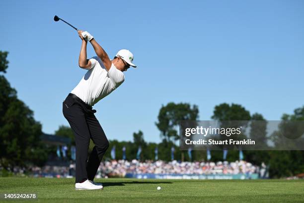 Haotong Li of China plays their second shot on the 18th hole during Day Four of the BMW International Open at Golfclub Munchen Eichenried on June 26,...