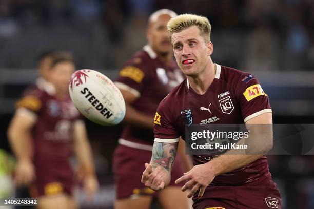 Cameron Munster of the Maroons passes the ball during game two of the State of Origin series between New South Wales Blues and Queensland Maroons at...