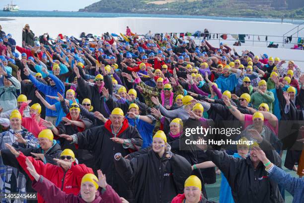 Participants rehearse on land before taking part in a Guinness World Record attempt for the largest number of people performing a synchronised...