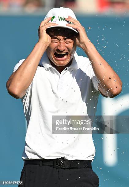 Haotong Li of China celebrates on the 18th hole following the playoff during Day Four of the BMW International Open at Golfclub Munchen Eichenried on...