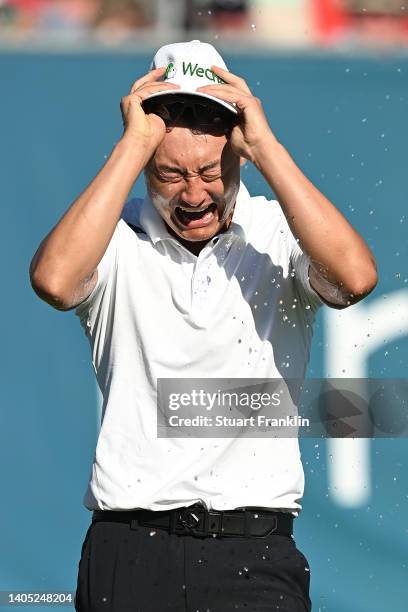 Haotong Li of China celebrates on the 18th hole following the playoff during Day Four of the BMW International Open at Golfclub Munchen Eichenried on...