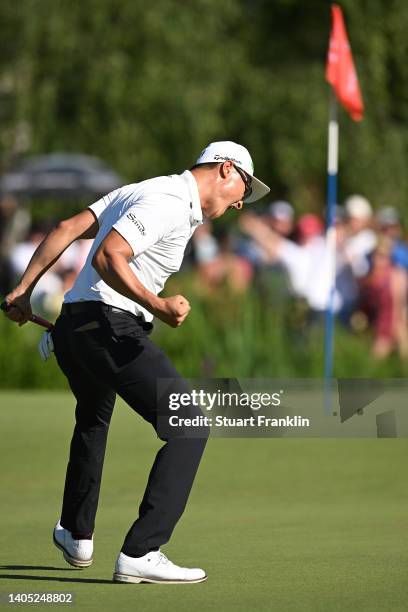 Haotong Li of China celebrates after putting on the 18th green in the playoff during Day Four of the BMW International Open at Golfclub Munchen...