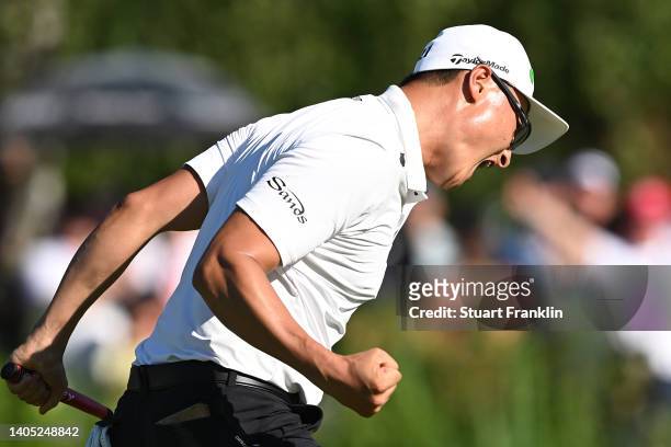 Haotong Li of China celebrates after putting on the 18th green in the playoff during Day Four of the BMW International Open at Golfclub Munchen...