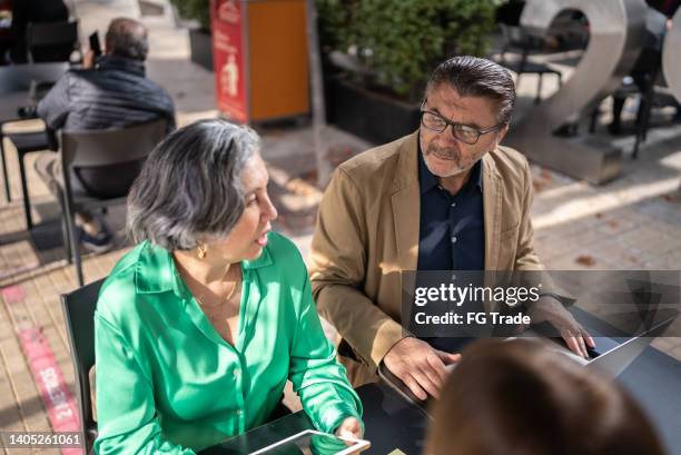 business people doing a meeting in a restaurant - business lunch outside stock pictures, royalty-free photos & images