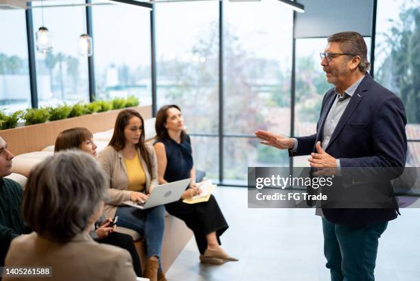 businessman doing a presentation in the conference room - cfo stock pictures, royalty-free photos & images