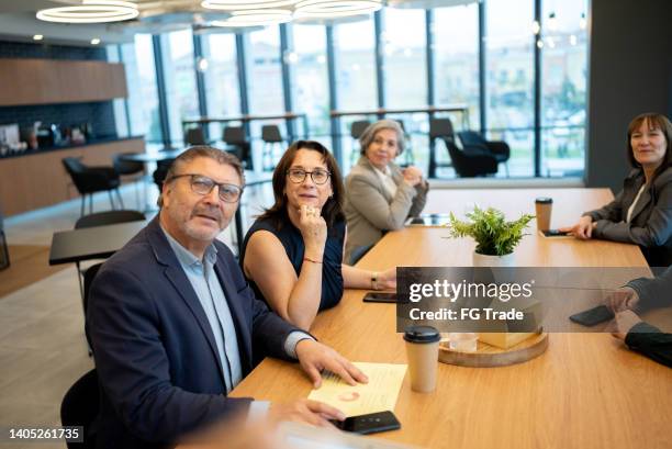 audience during a business meeting in the office - small group of people stock pictures, royalty-free photos & images