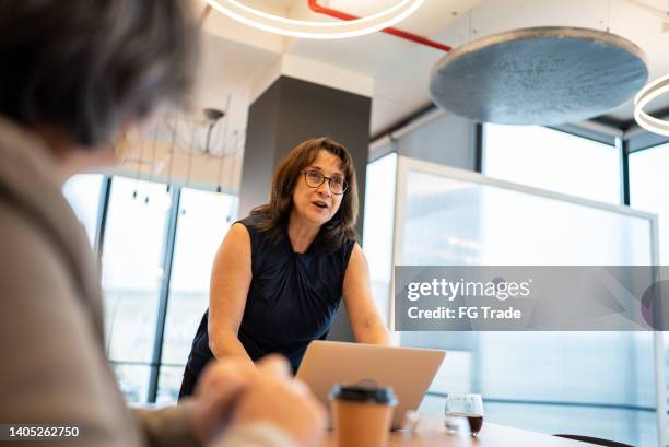 businesswoman doing a presentation in the conference room - chief financial officers stock pictures, royalty-free photos & images