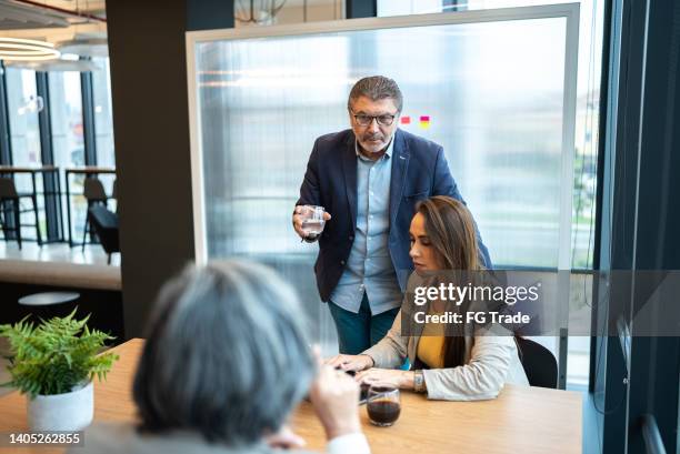 coworkers having a meeting in the office - cfo stock pictures, royalty-free photos & images