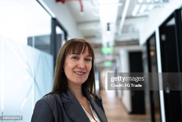 portrait of a businesswoman in the office - cfo stock pictures, royalty-free photos & images