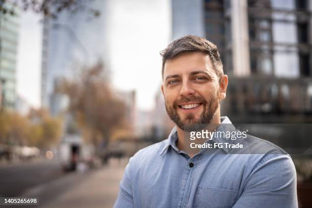 portrait of mid adult man outdoors - mid adult men stock pictures, royalty-free photos & images