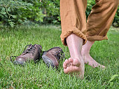 Barefoot walking, earthing and grounding concept