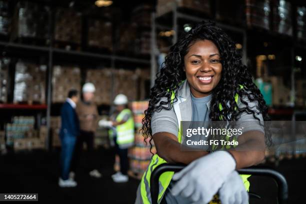 portrait of a warehouse worker - production line worker stock pictures, royalty-free photos & images