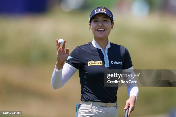 In Gee Chun of South Korea waves after putting on the 11th green during the final round of the KPMG Women's PGA Championship at Congressional Country...