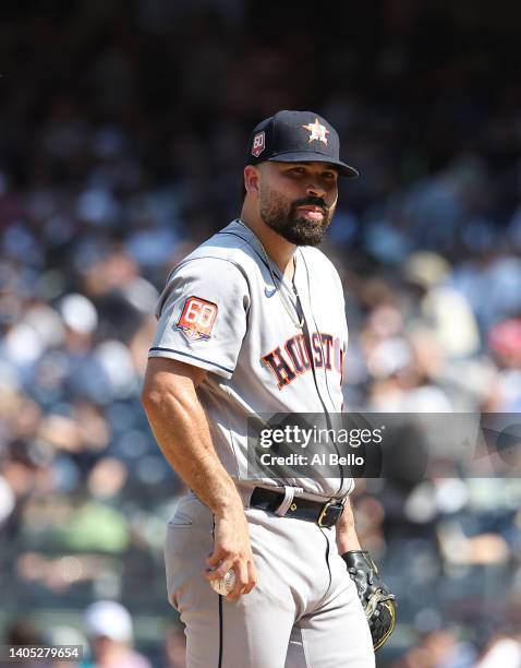 Jose Urquidy of the Houston Astros looks on after giving up Houston a home run in the seventh inning against Giancarlo Stanton of the New York...